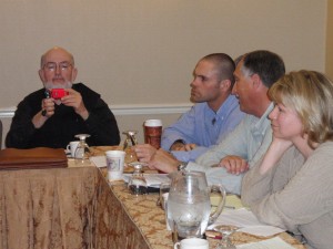 Mike McGrath, left, took photos during the roundtable