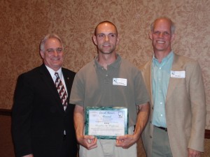 Doug Wolfgang with Agriculture Secretary Greig and Jim Baird of American Farmland Trust